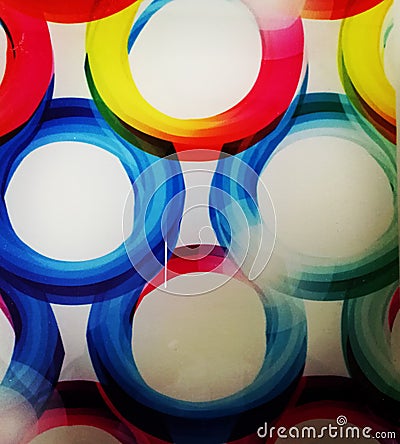 Colour circles on glass base. Stock Photo