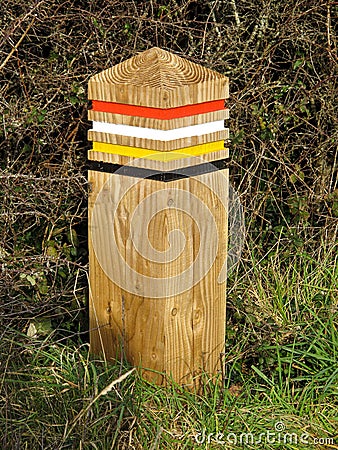 Colour Coded Wooden Post on the South West Coast Path, UK Stock Photo