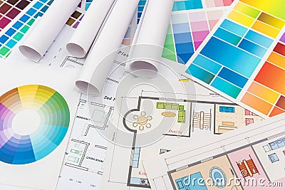 Colour palettes with house plan on desk top view. Designer working at new project Stock Photo