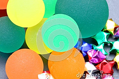 Coloured rubber ball and stars on dark background Stock Photo