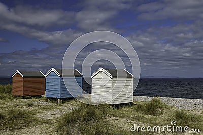 Colourful beach huts on Findhorn Beach, Moray Firth, Scotland Editorial Stock Photo