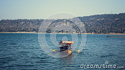 Colourful boat in scenery of lake Editorial Stock Photo