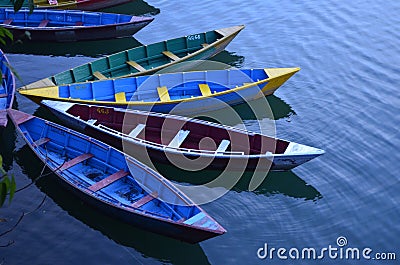 Colourful Boats alongside amazing Phewa Lake in Pokhara, Nepal Editorial Stock Photo