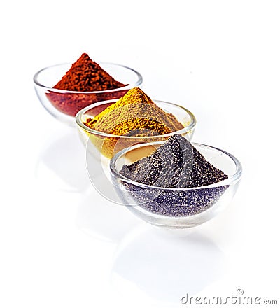 Colourful bowls of ground spice Stock Photo