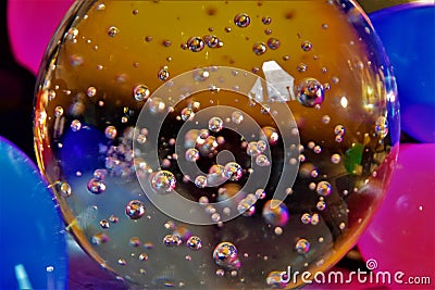 Colourful bubbles in a crystal ball close up Stock Photo