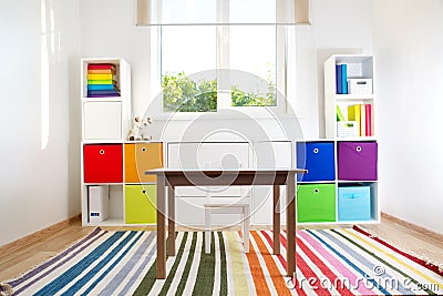 Colourful children rooom with white walls and furniture Stock Photo