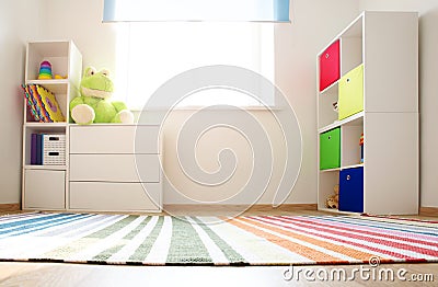 Colourful children rooom with white walls and furniture Stock Photo