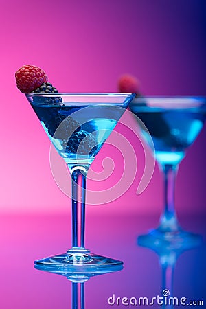 Colourful cocktails garnished with berries Stock Photo