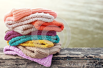 A colourful collection of bobble hats lined up Stock Photo