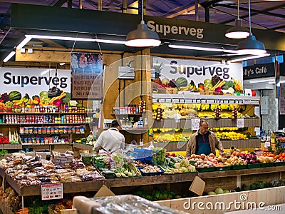 Colourful displays of fresh fruit and vegetables by green grocers in the new Market Hall in Preston, Lancashire, UK Editorial Stock Photo