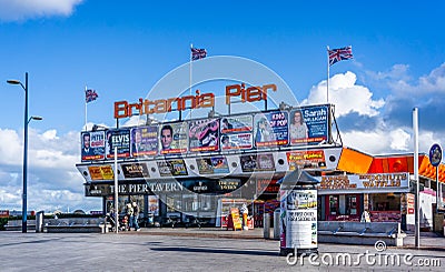 Colourful entrance to Britannia Pier with posters advertising coming shows in Great Yarmouth, Norfolk Editorial Stock Photo