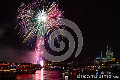 Colourful firework in front of the cathedral of Cologne Stock Photo