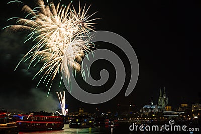 Colourful firework in front of the cathedral of Cologne Stock Photo