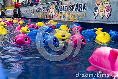 Colorful fishing game at a country fun fair. Editorial Stock Photo