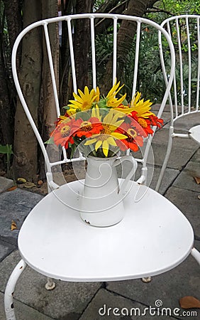 Colourful flower from garden in white vase Stock Photo