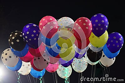 Colourful balloons flutterng in the air Stock Photo