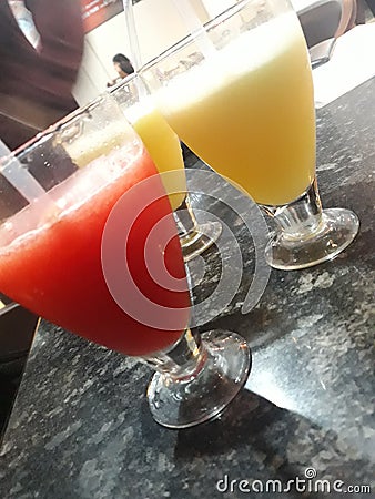 Colourful glasses of juice and friends what else life wants Stock Photo