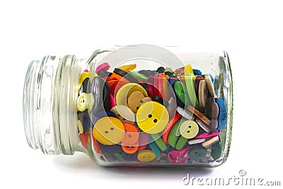 Colourful haberdashery buttons in a glass jar Stock Photo