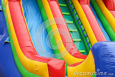 A colourful inflatable slide at a carnival Stock Photo