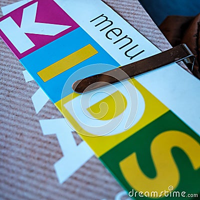 Colourful Kids Or Childrens Menu On A Restaurant Table Stock Photo