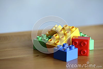 Colourful lego bricks on wooden background Stock Photo