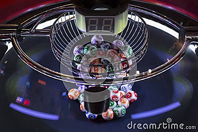 Colourful lottery balls in a lotto machine Stock Photo