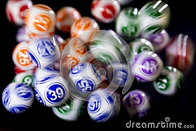 Colourful lottery balls in a machine Stock Photo