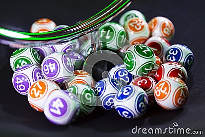 Colourful lottery balls in a machine Stock Photo