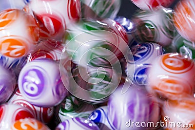 Colourful lottery balls in a machine Stock Photo