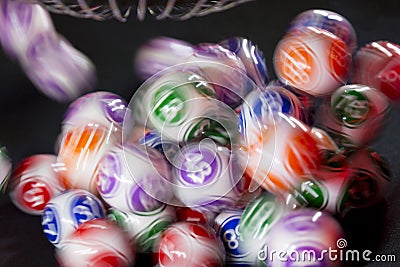 Colourful lottery balls in a machine Stock Photo