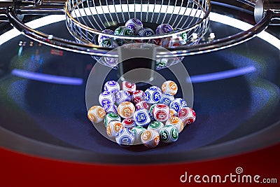 Colourful lottery balls in a machine Stock Photo