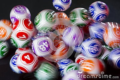 Colourful lottery balls in a sphere Stock Photo