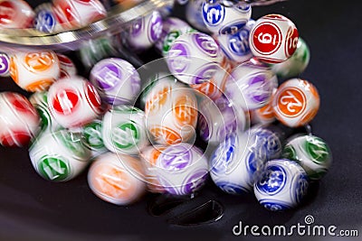 Colourful lottery balls in a sphere Stock Photo