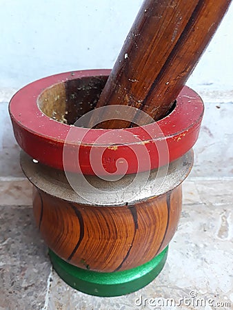 Colourful mortar pestle made up of wood. Stock Photo