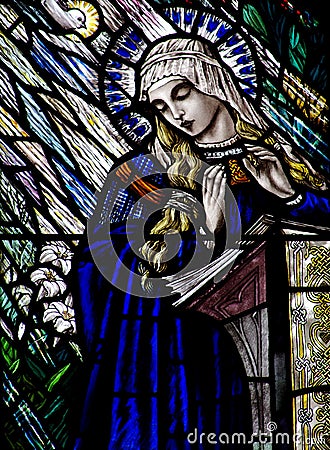 Annunciation in stained glass Mary, and the Holy Spirit Stock Photo