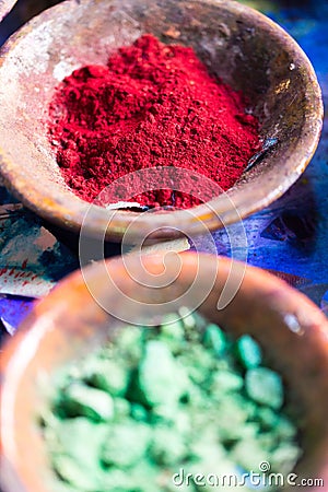 Colourful pigment powders in clay pots Stock Photo