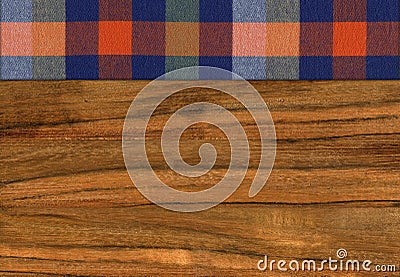 Colourful plaid napkin on walnut wooden floor table or cutting board Stock Photo