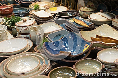 Colourful porcelain plates and mug Stock Photo