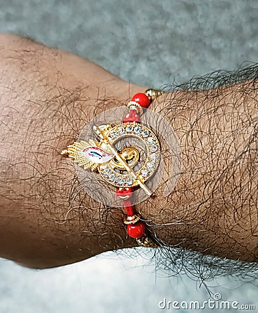 Colourful Rakhi on the wrist of a brother during Rakshya Bandhan festival in India Stock Photo