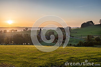 Colourful sunrise and spectacular views over the Dutch hillside and the picturesque Beusdael castle Stock Photo