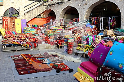 Colourful textiles in Doha market Stock Photo