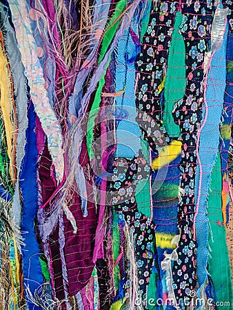 Colourful textured fabric strips sewn together. Textile art background. Stock Photo
