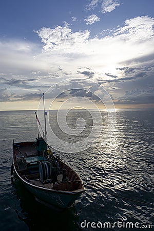 Colourful Thailand fishing boats at sunset wood fishing boats used in Asia for sustainable fishing in shallow seas Stock Photo