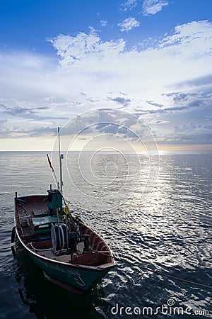 Colourful Thailand fishing boats at sunset wood fishing boats used in Asia for sustainable fishing in shallow seas Stock Photo