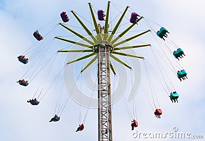 Colourful Theme park attraction with coloured seats Stock Photo