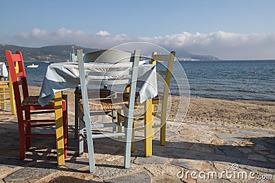 Typical, colourful greek chairs and table Stock Photo