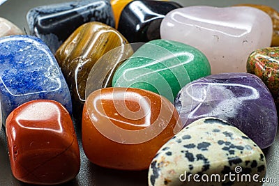 Colourful tumbled gemstones and crystals Stock Photo