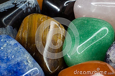 Colourful tumbled gemstones and crystals Stock Photo