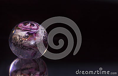 Colourful violet red white sphere on black background with reflection as modern abstract decorative healing object Stock Photo