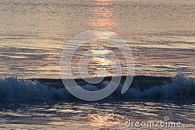 Colourful wave at sunrise in Hawaii Stock Photo